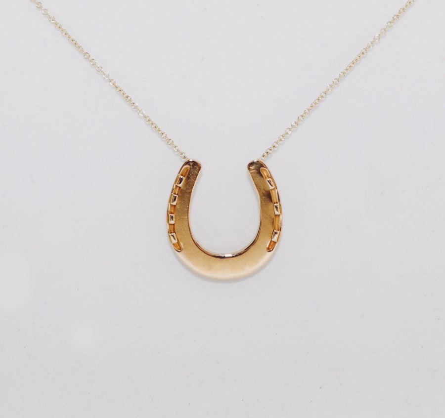 Gold horse-shoe necklace