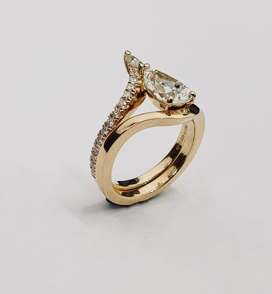 'The Carrie' 18 Carat Yellow Gold Pear Shaped Diamond Engagement Ring and Matching Wedding Ring